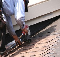 Worker Replacing Roof - Federal Construction